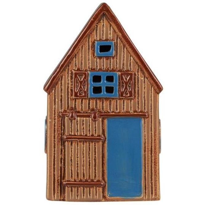 Hovedbilde IB Laursen Hus Visby m blå låvedørfor telys